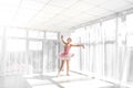 Elegant female ballet dancer in pink tutu practicing and smiling Royalty Free Stock Photo