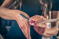 Female barber is getting ready to shave