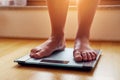 Female bare feet on weight scale Royalty Free Stock Photo