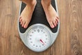 Female bare feet on weight scale Royalty Free Stock Photo