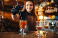 Female bartender making coctail at the bar counter Royalty Free Stock Photo