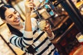 Female bartender tapping beer in bar Royalty Free Stock Photo
