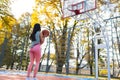 Female basketball player getting ready to make a ball throw to the basket. Royalty Free Stock Photo