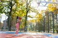 Female basketball player getting ready to make a ball throw to the basket. Royalty Free Stock Photo