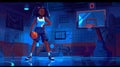 A female basketball player poses at night with the ball in hand and her arm akimbo in a dark gymnasium sports arena Royalty Free Stock Photo