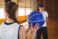 Female basketball player practicing with male coach Royalty Free Stock Photo