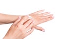 Female beautiful delicate manicured hands with moisturizing cream