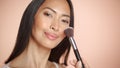 Female Beauty Portrait. Beautiful Happy Multiethnic Asian Brunette Woman Using Blush Makeup Brush Royalty Free Stock Photo