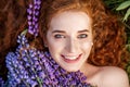 Female beauty portrait. Red-haired girl smiles. The concept of fashion, beauty, cosmetics and care Royalty Free Stock Photo