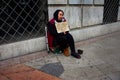 Urban scene: a female beggar in Granada 34