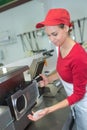 Female behind counter at sandwich bar Royalty Free Stock Photo