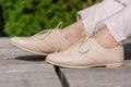 Fashionable Beige Lacquer Shoes: Stylish Footwear for a Spring Day in the Park