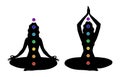 Female black silhouette with seven colored chakras. A woman practices yoga in the lotus position with the designation of