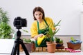 The female blogger explaining houseplants growing