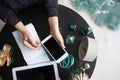 Female blogger with smartphone and notebook Royalty Free Stock Photo