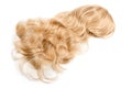 Female blonde wig isolated on white. Golden human hair weaves, extensions and wigs. Woman beauty concept