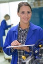 Female blue collar worker using tablet Royalty Free Stock Photo
