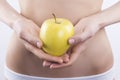 Female body and apple Royalty Free Stock Photo