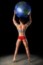 Female Bodybuilder Lifting Earth Royalty Free Stock Photo