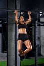 Female bodybuilder training in gym.