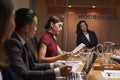 Female boss chairing business meeting in boardroom, close up Royalty Free Stock Photo