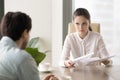 Female boss looking angry dissatisfied with male employee work r Royalty Free Stock Photo