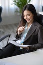 Female boss reading on her notebook Royalty Free Stock Photo