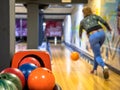 Female bowler throwing bowling ball Royalty Free Stock Photo