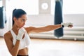 Female boxer practicing her punches at a boxing studio