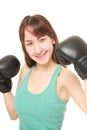 Female boxer with punching gloves in a victory pose Royalty Free Stock Photo