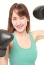 Female boxer with punching gloves in a victory pose Royalty Free Stock Photo