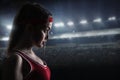 Female boxer in red sportswear, side view