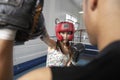 Female Boxer Striking Her Target In Ring