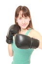 Female boxer throws a left hook Royalty Free Stock Photo