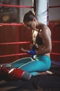 Female boxer wearing blue strap on wrist