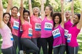 Female breast cancer marathon runners cheering Royalty Free Stock Photo