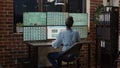 Female broker analyzing stock market sales growing on multi monitors Royalty Free Stock Photo