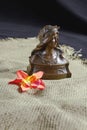 Female Bronze Bust and Flower