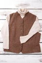 Female brown vest and white sweater. Royalty Free Stock Photo