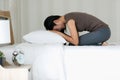 Female Buddhist sitting on bed in the bedroom and pay homage in Buddhism religion style. The idea for faith and trust in religion