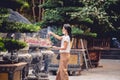 Female Buddhist worshiper burning incense near a Buddhist temple in Vietnam