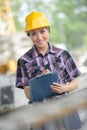 Female builder with clipboard