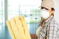 female builder holding sheets insulation and wearing face mask Royalty Free Stock Photo