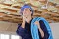Female builder looking at ceiling Royalty Free Stock Photo