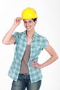 Female builder touching hat Royalty Free Stock Photo