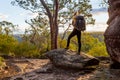 Female bushwalker with backpack walking in Australian bushland Royalty Free Stock Photo