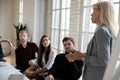 Female business leader giving workshop to employees Royalty Free Stock Photo