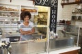 Female business owner behind the counter at a sandwich bar Royalty Free Stock Photo