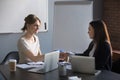 Female business partners handshaking after successful negotiatio Royalty Free Stock Photo