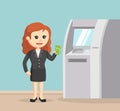 Female business people using ATM